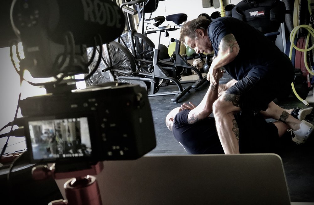 Coach Blauer and training partner demonstrating SPEAR System drills in the Tactical Garage Gym