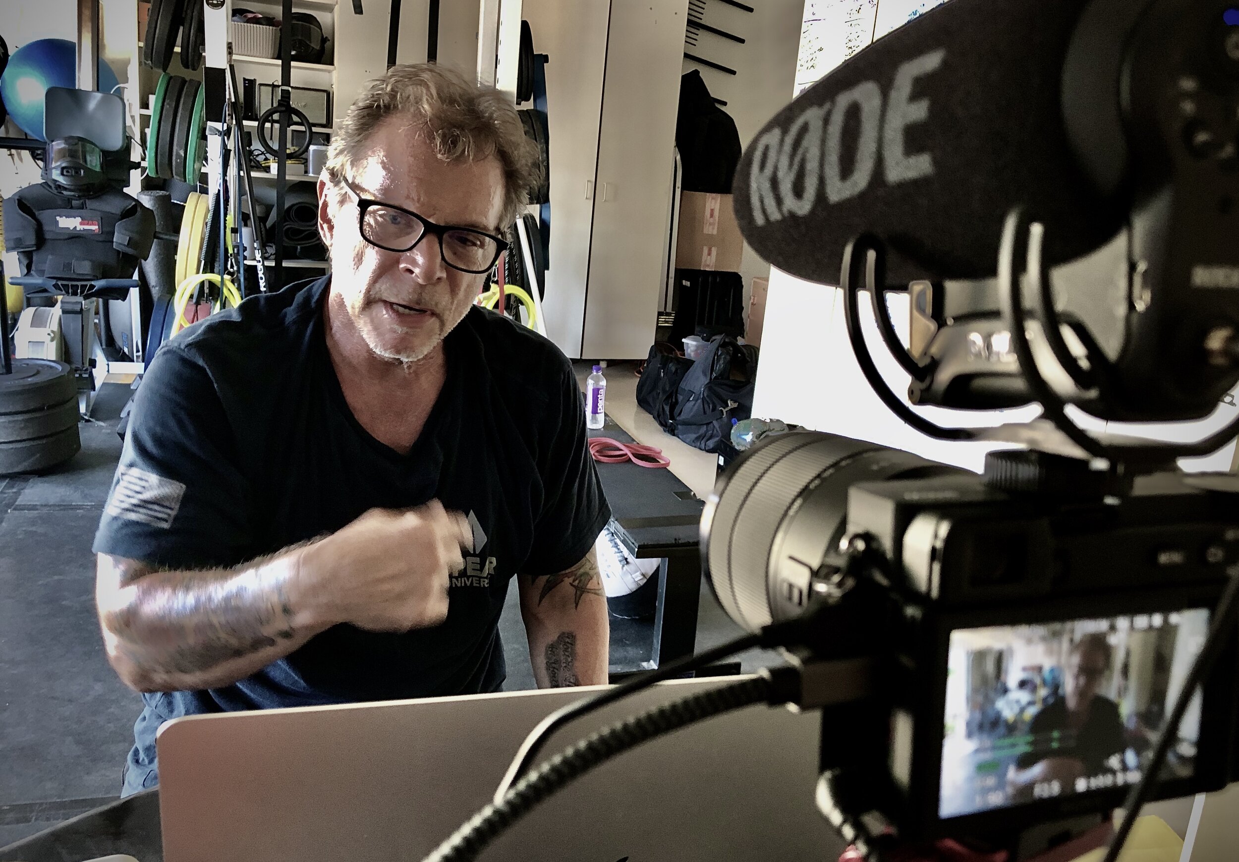 Coach Tony Blauer coaching live to camera in the Tactical Garage Gym